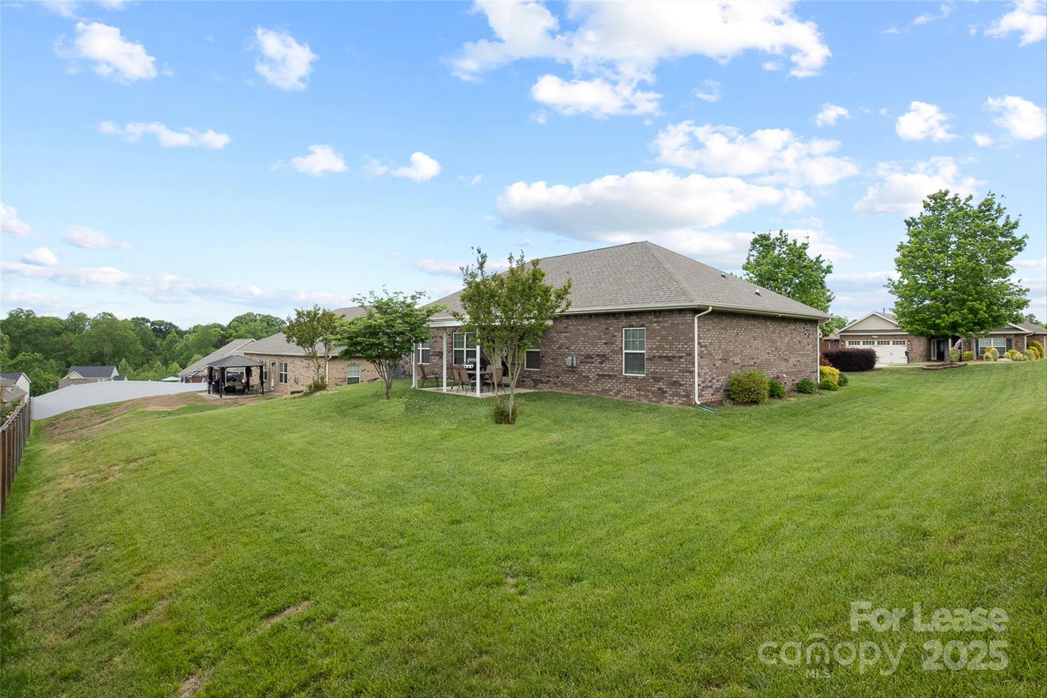 7266 Kenyon Drive Denver, NC 28037 - Photo 24 of 25 a front view of a house with garden