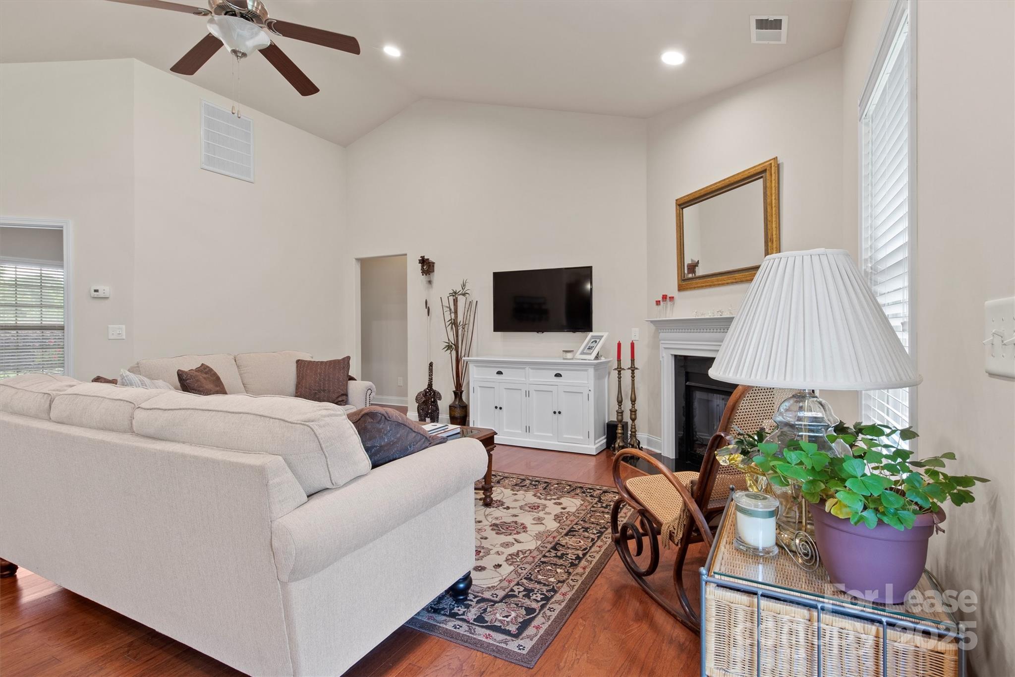 7266 Kenyon Drive Denver, NC 28037 - Photo 7 of 25 a living room with furniture and a flat screen tv