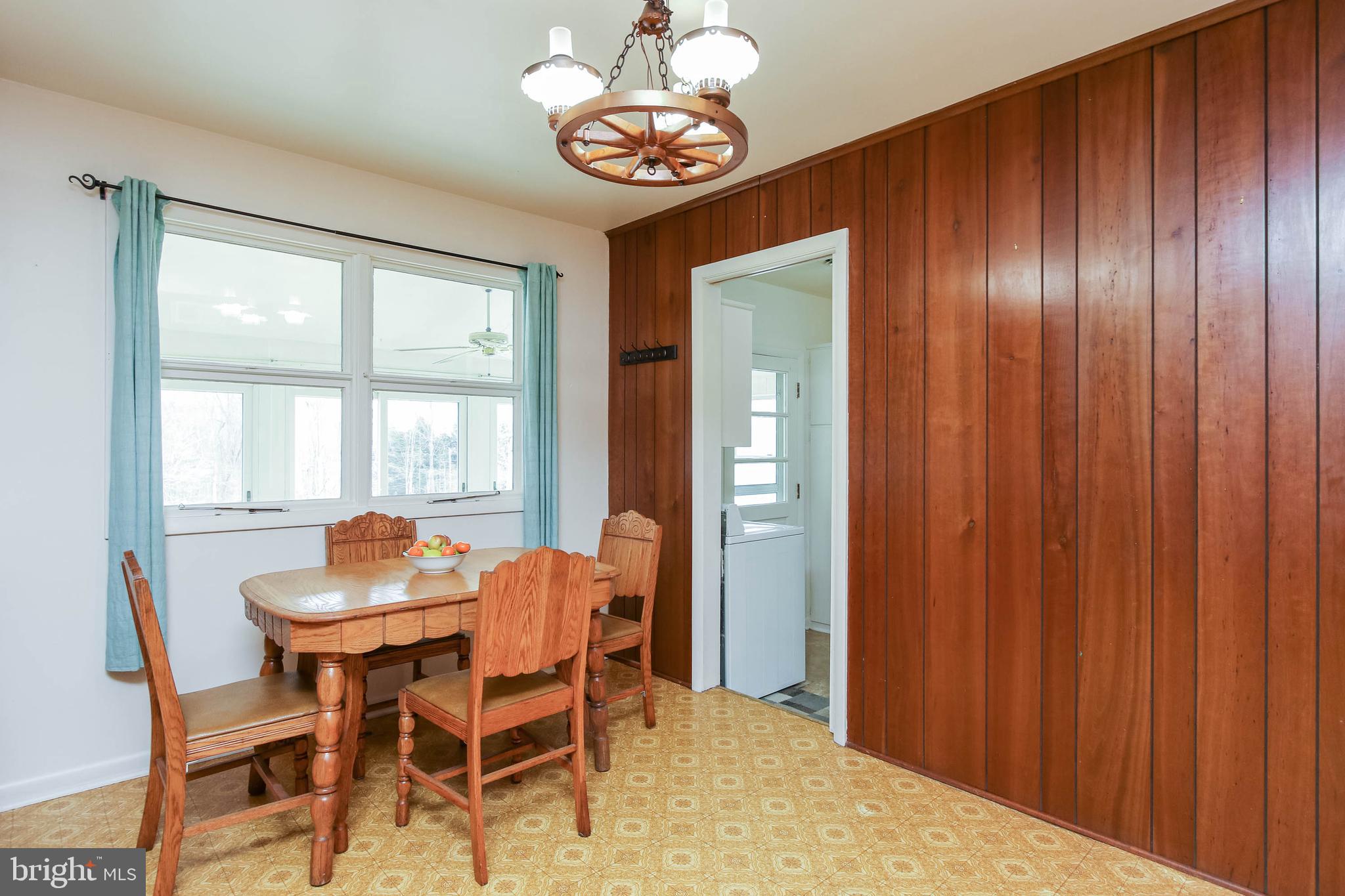 5004 Old Quarter Road Upperco, MD 21155 - Photo 14 of 61 a dining room with furniture a chandelier and wooden floor