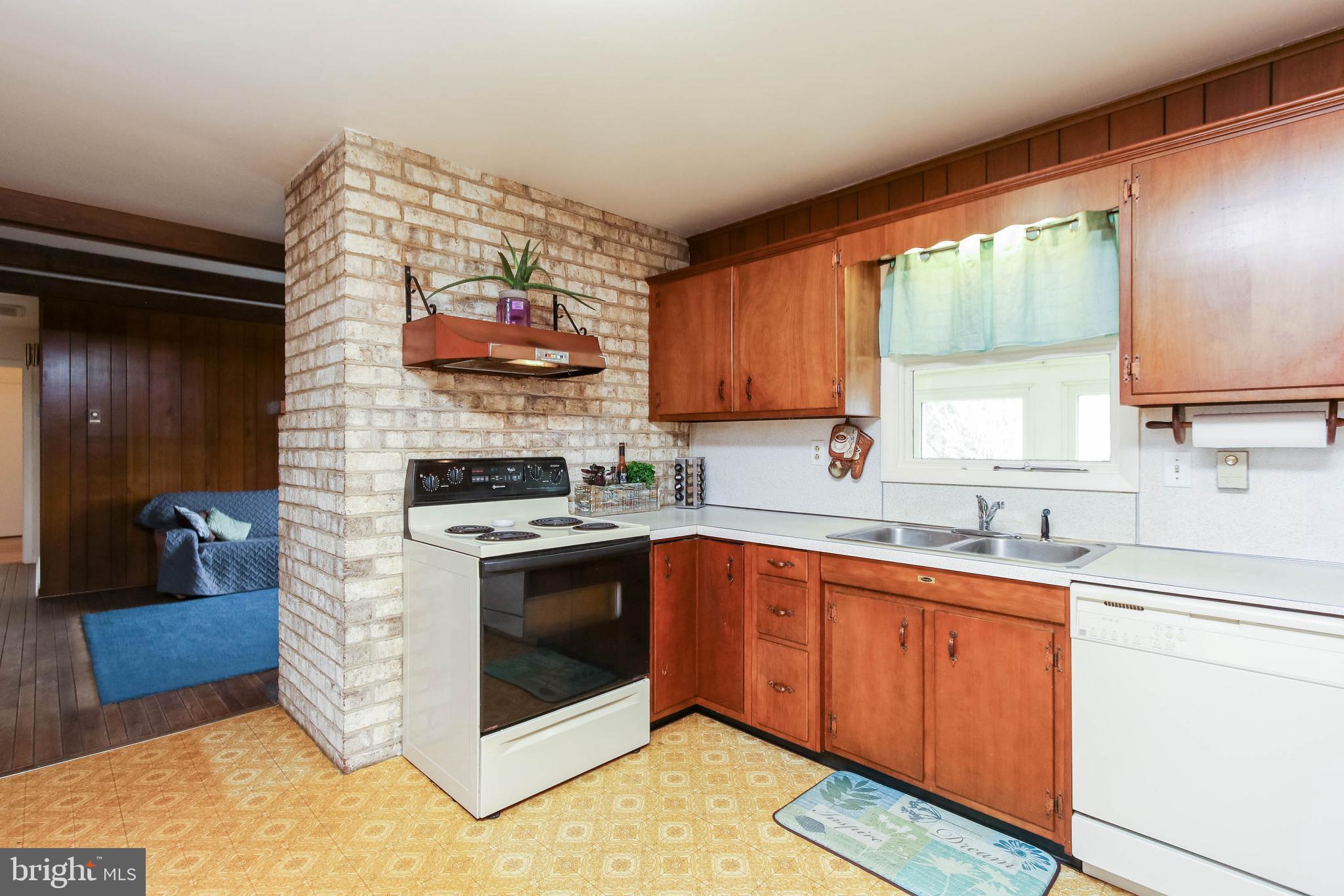 5004 Old Quarter Road Upperco, MD 21155 - Photo 15 of 61 a kitchen with a sink stove and cabinets