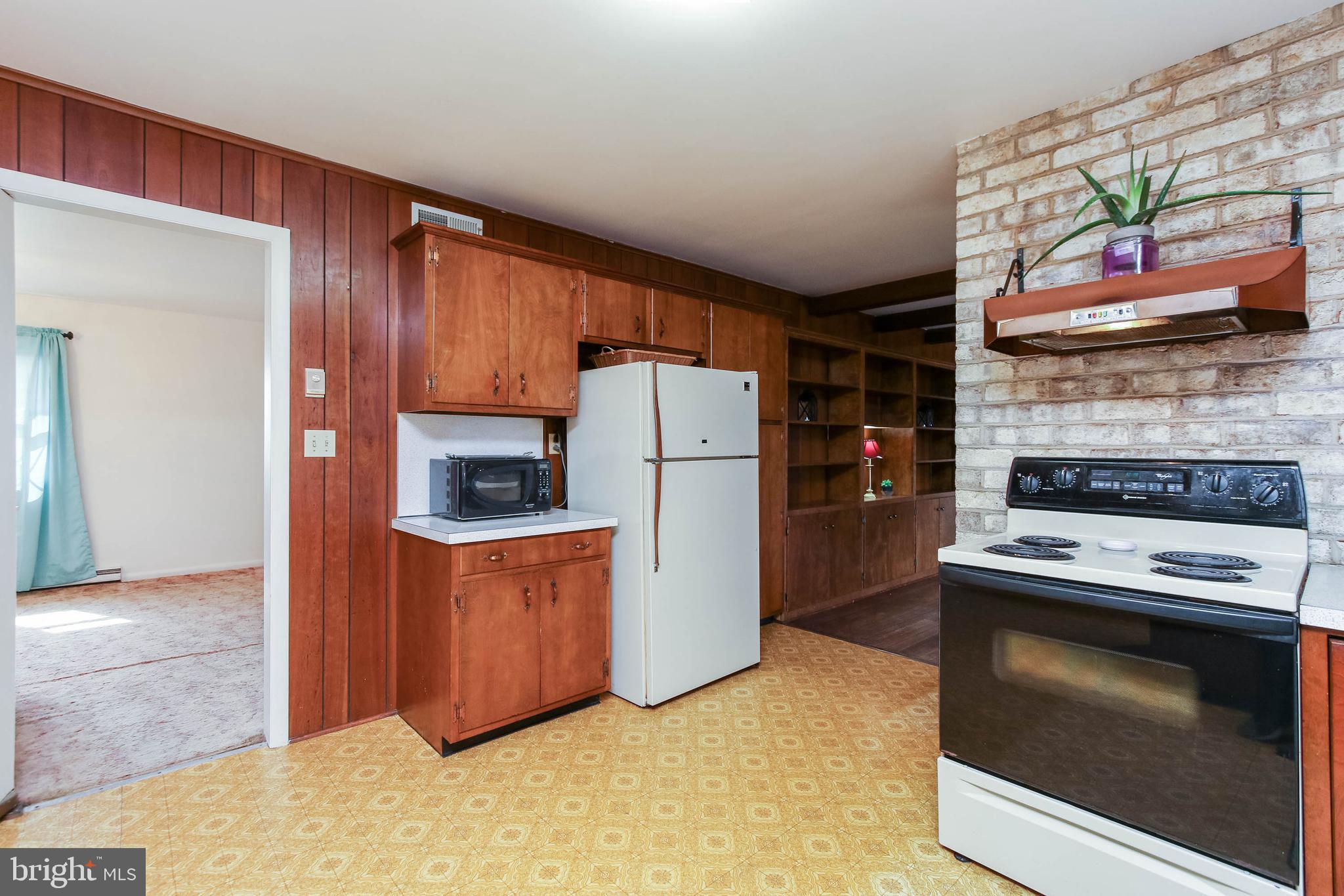 5004 Old Quarter Road Upperco, MD 21155 - Photo 16 of 61 a kitchen with stainless steel appliances granite countertop a refrigerator stove and a sink