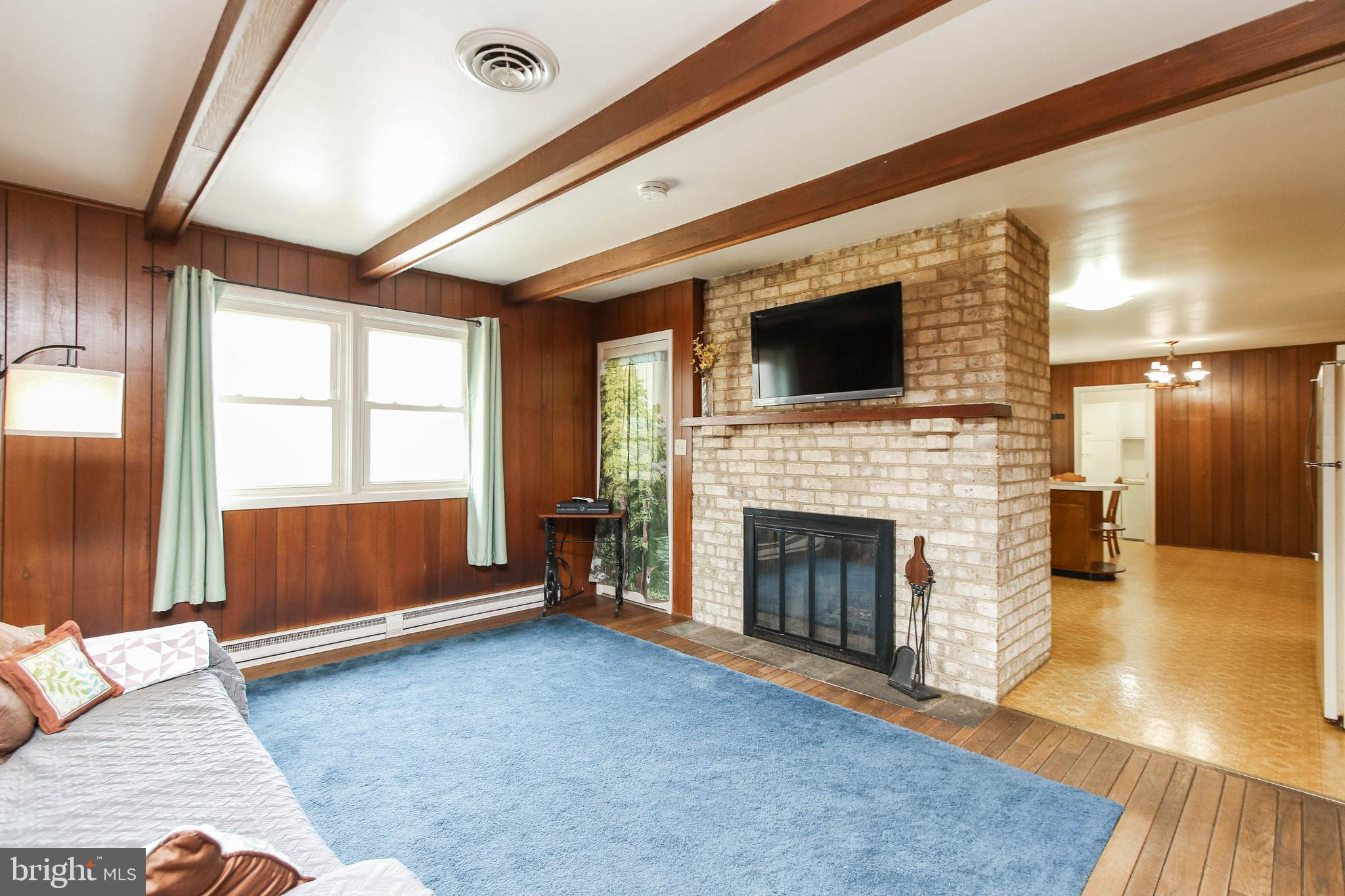 5004 Old Quarter Road Upperco, MD 21155 - Photo 19 of 61 a living room with furniture and a fireplace