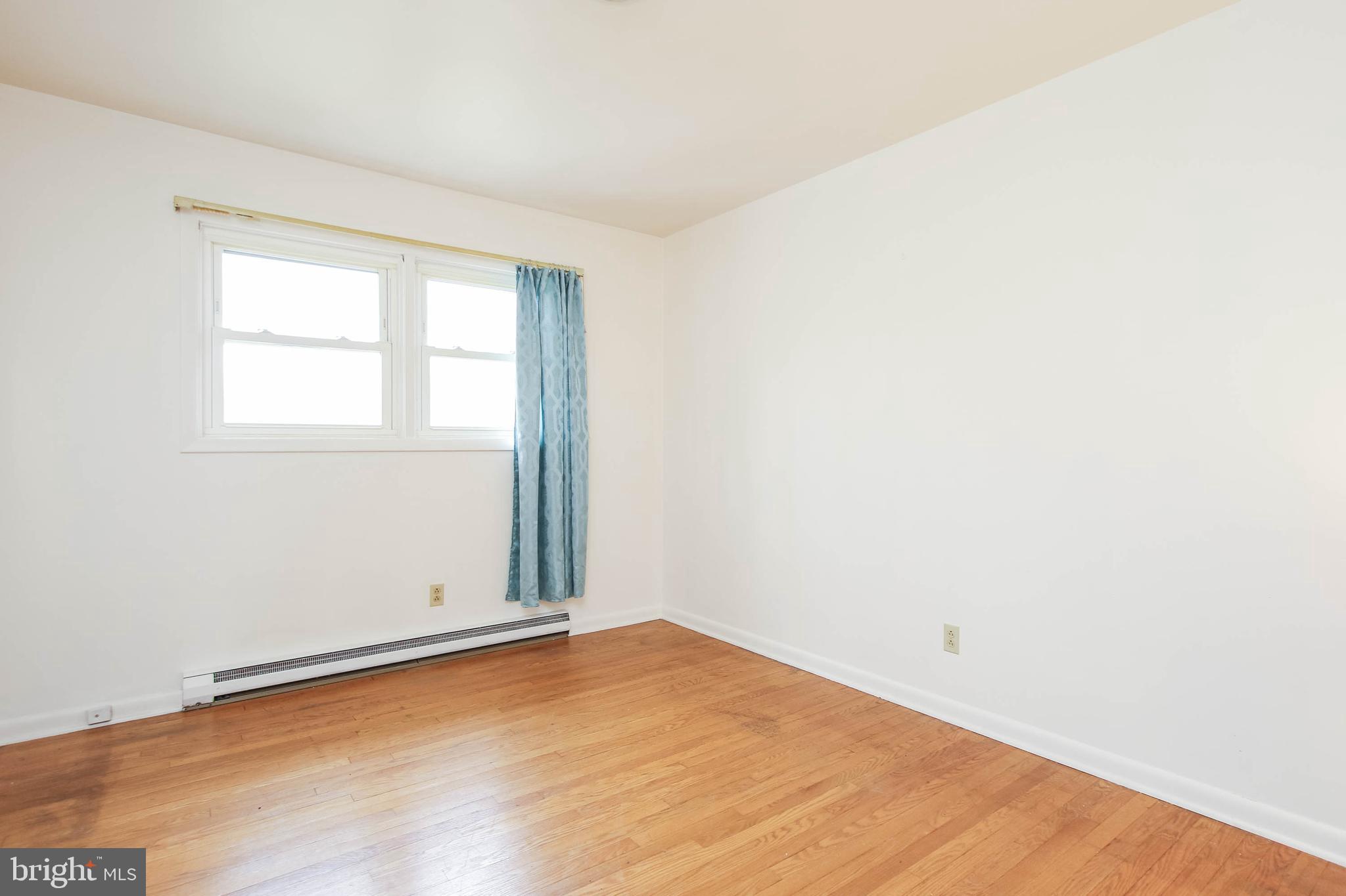 5004 Old Quarter Road Upperco, MD 21155 - Photo 28 of 61 an empty room with wooden floor and windows