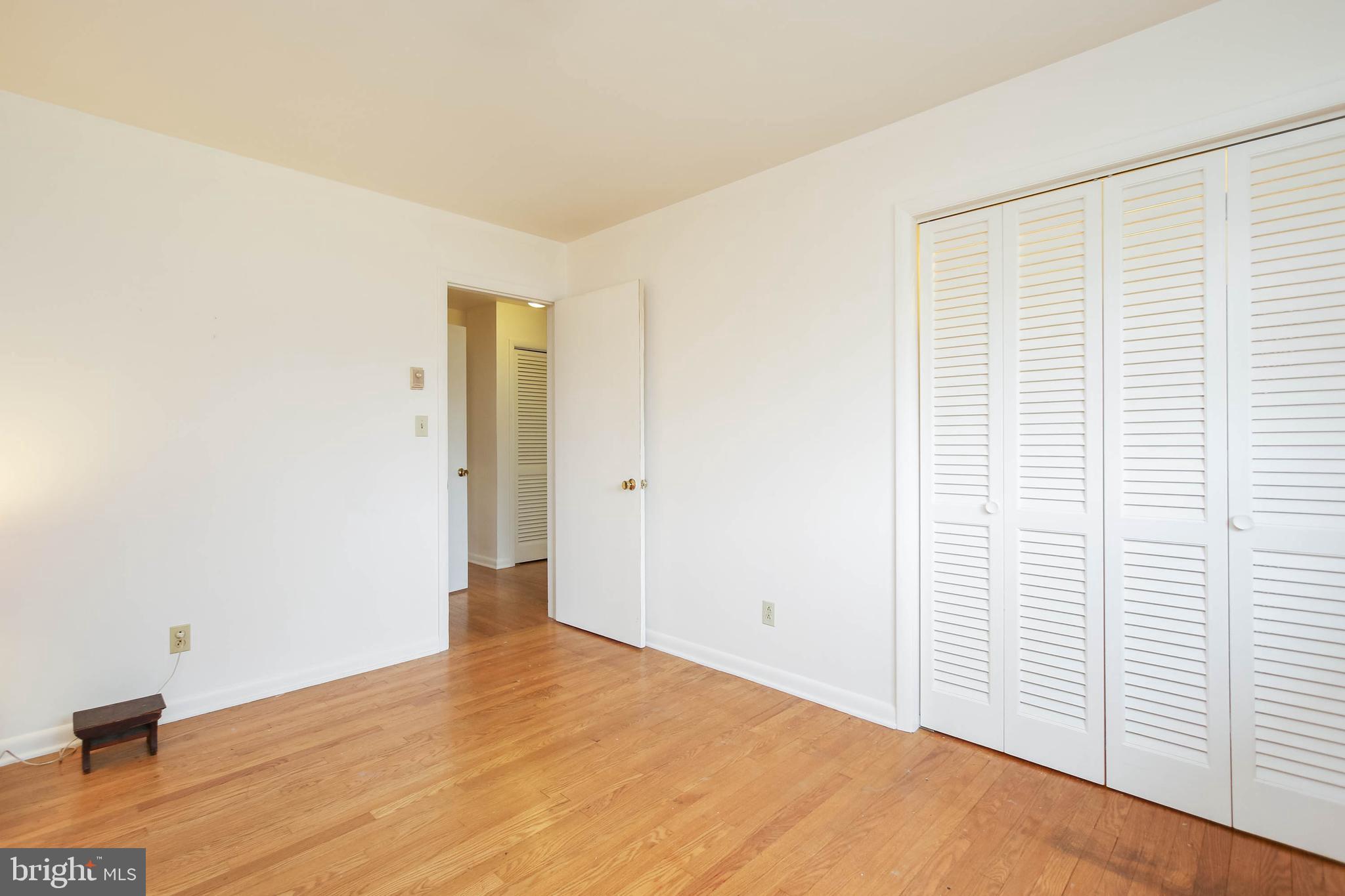 5004 Old Quarter Road Upperco, MD 21155 - Photo 29 of 61 a view of an empty room with wooden floor and a window
