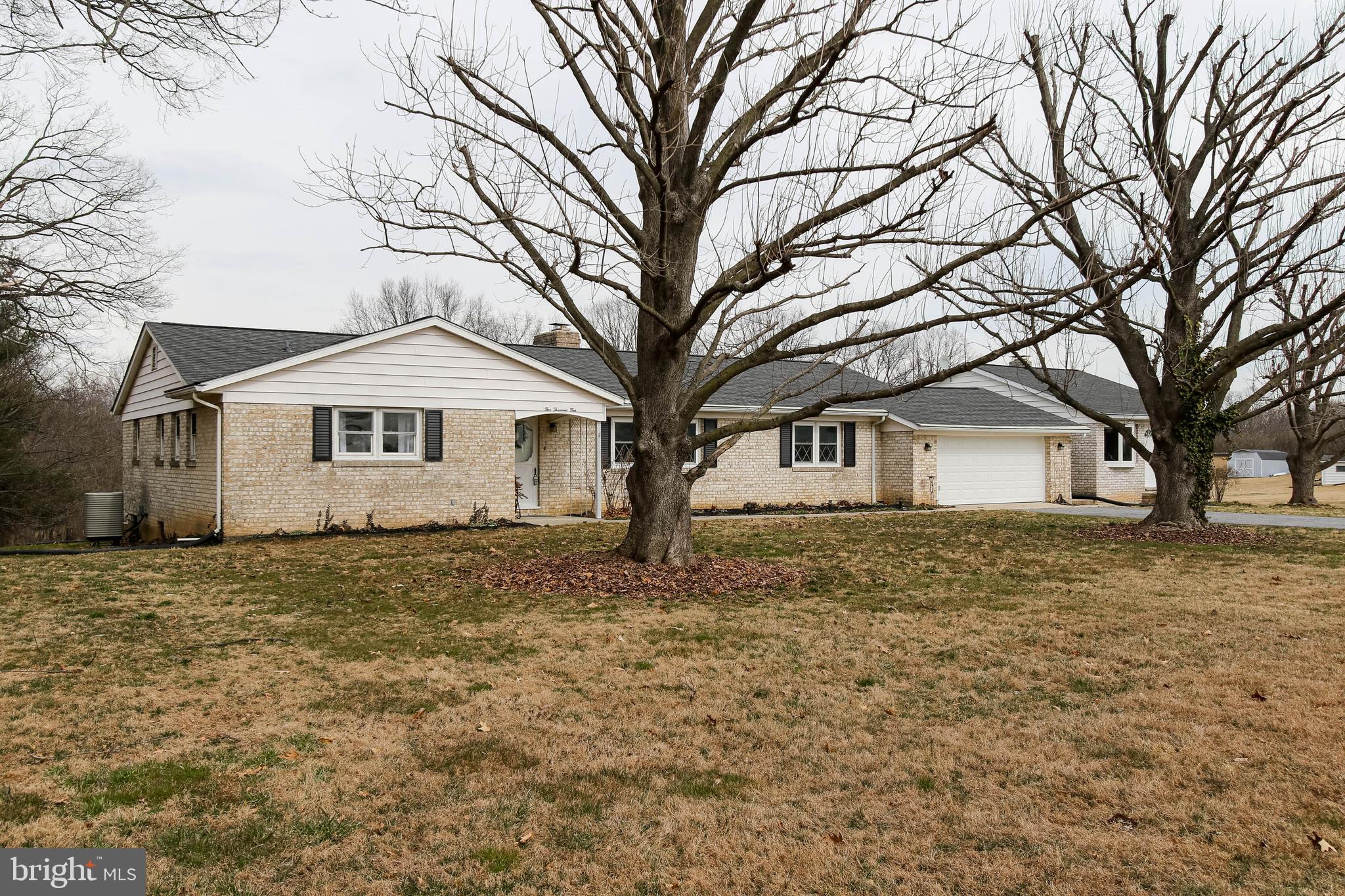 5004 Old Quarter Road Upperco, MD 21155 - Photo 4 of 61 a front view of a house with a yard