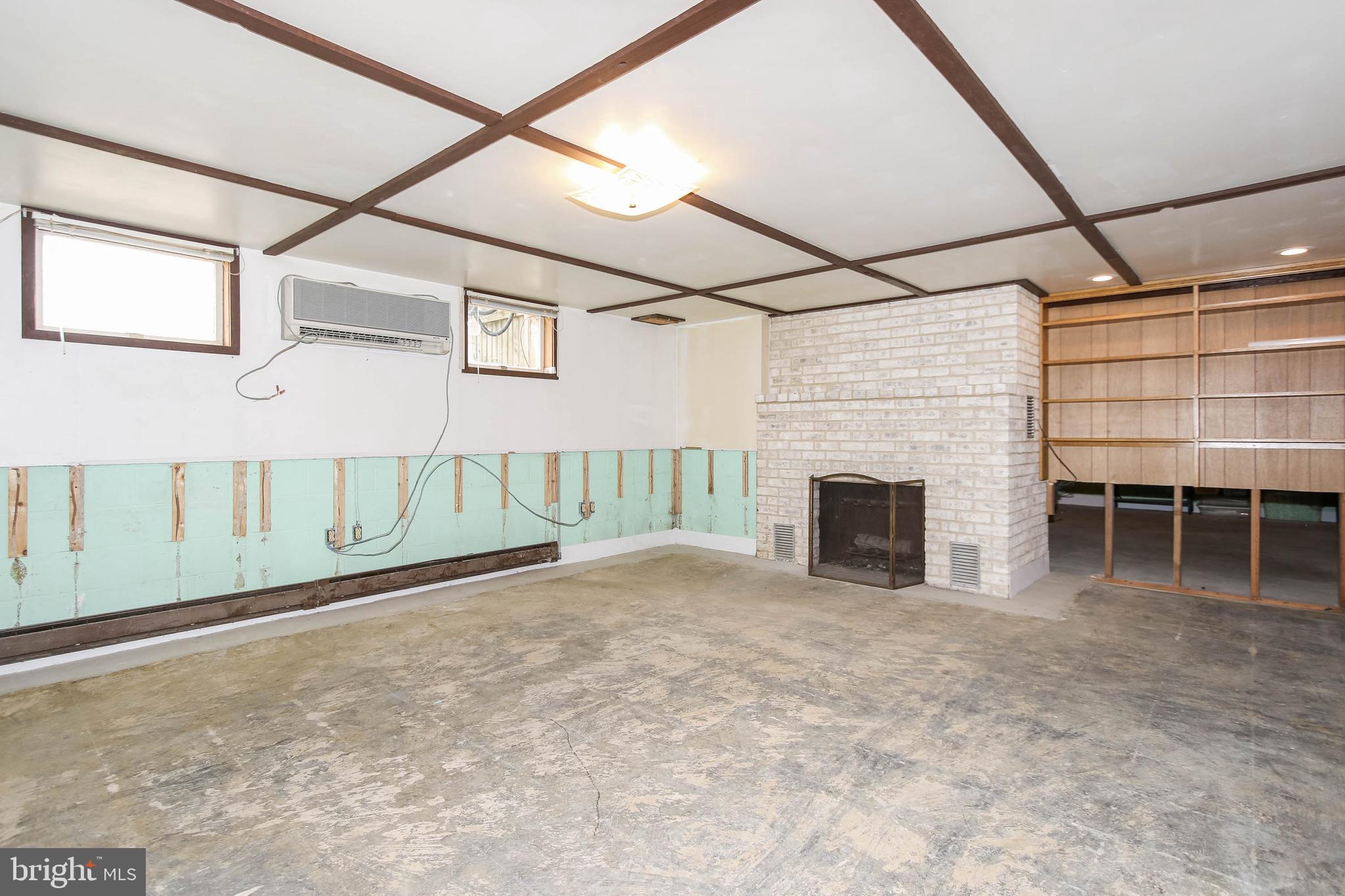 5004 Old Quarter Road Upperco, MD 21155 - Photo 34 of 61 A wood burning fireplace is in the basement also.