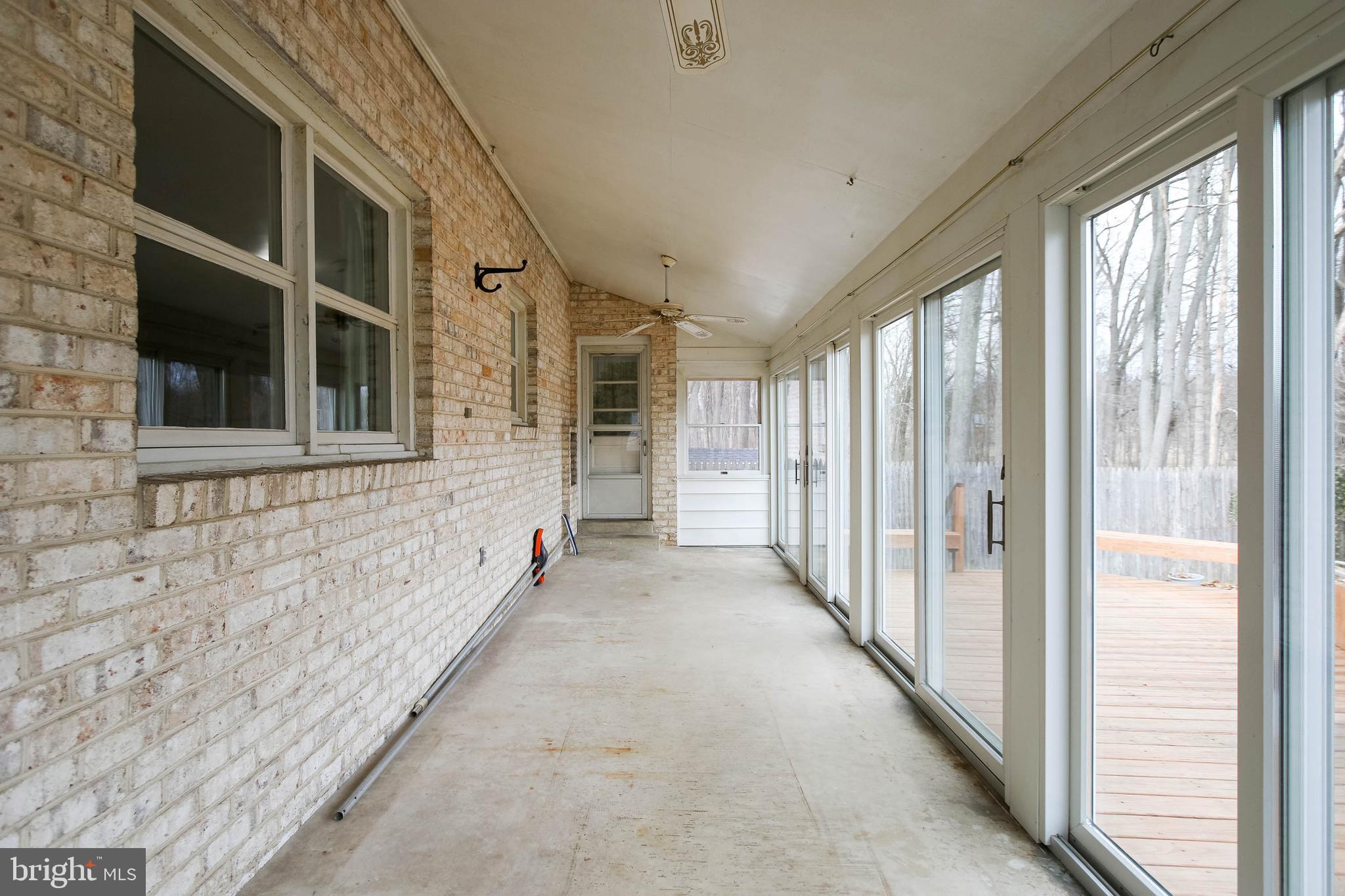 5004 Old Quarter Road Upperco, MD 21155 - Photo 48 of 61 a view of an entryway with wooden floor and windows