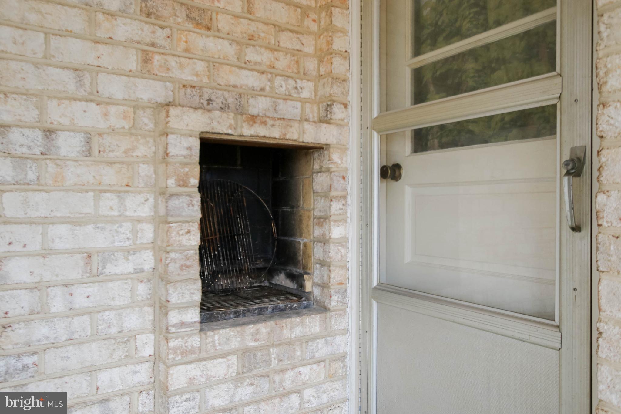 5004 Old Quarter Road Upperco, MD 21155 - Photo 49 of 61 The enclosed patio has a built-in grill.