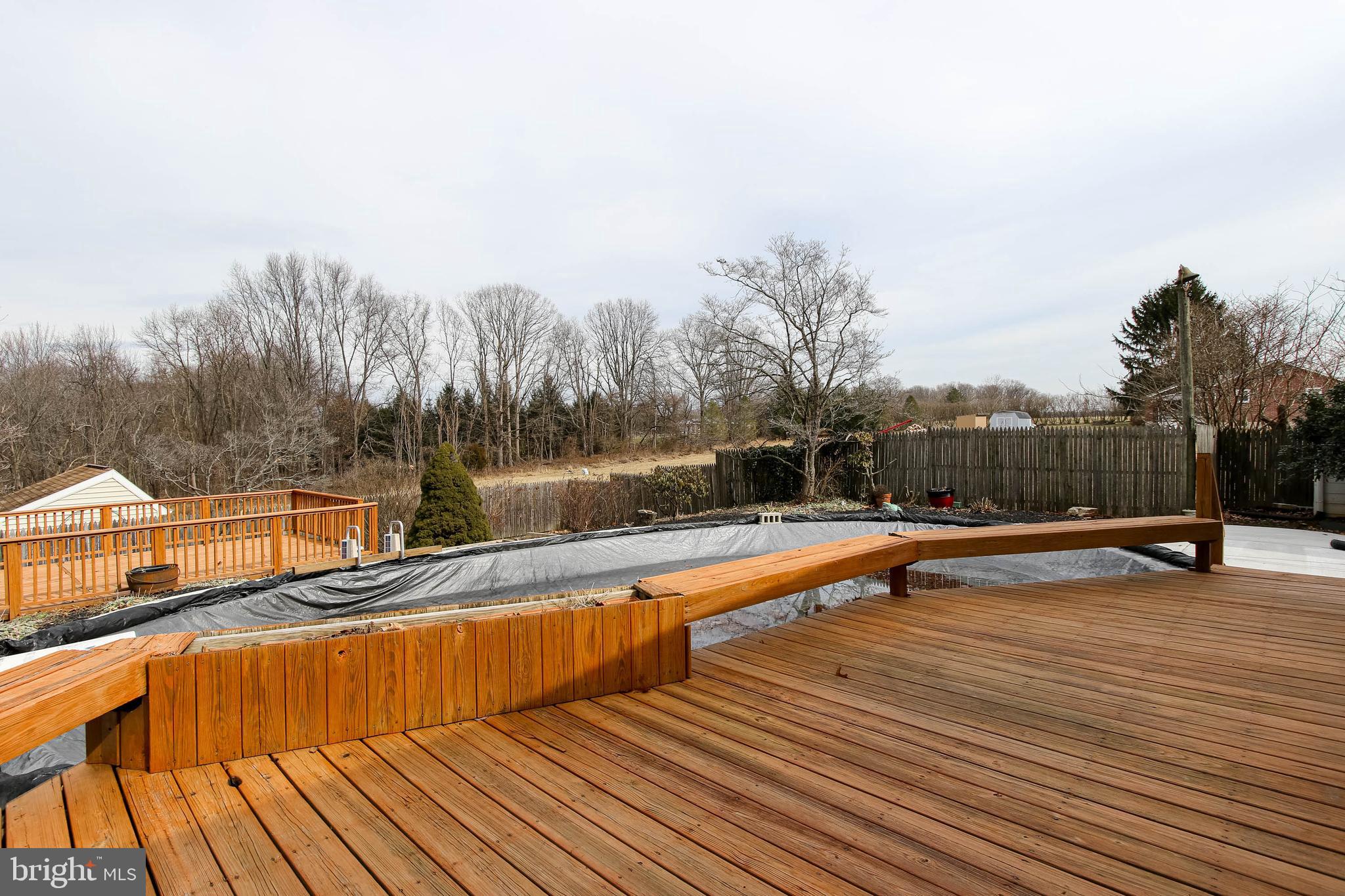 5004 Old Quarter Road Upperco, MD 21155 - Photo 51 of 61 a view of swimming pool with seating area and trees in the background