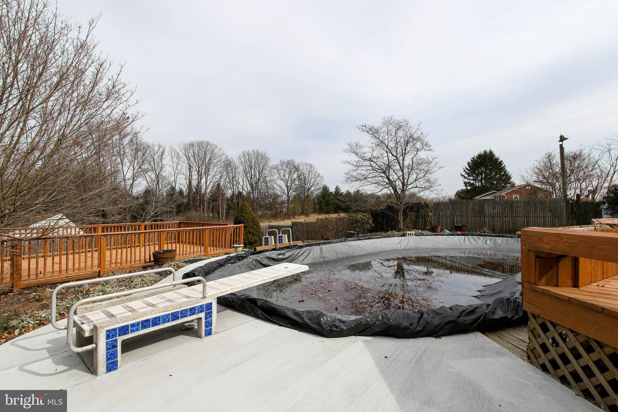 5004 Old Quarter Road Upperco, MD 21155 - Photo 53 of 61 a view of a terrace with couches and wooden fence