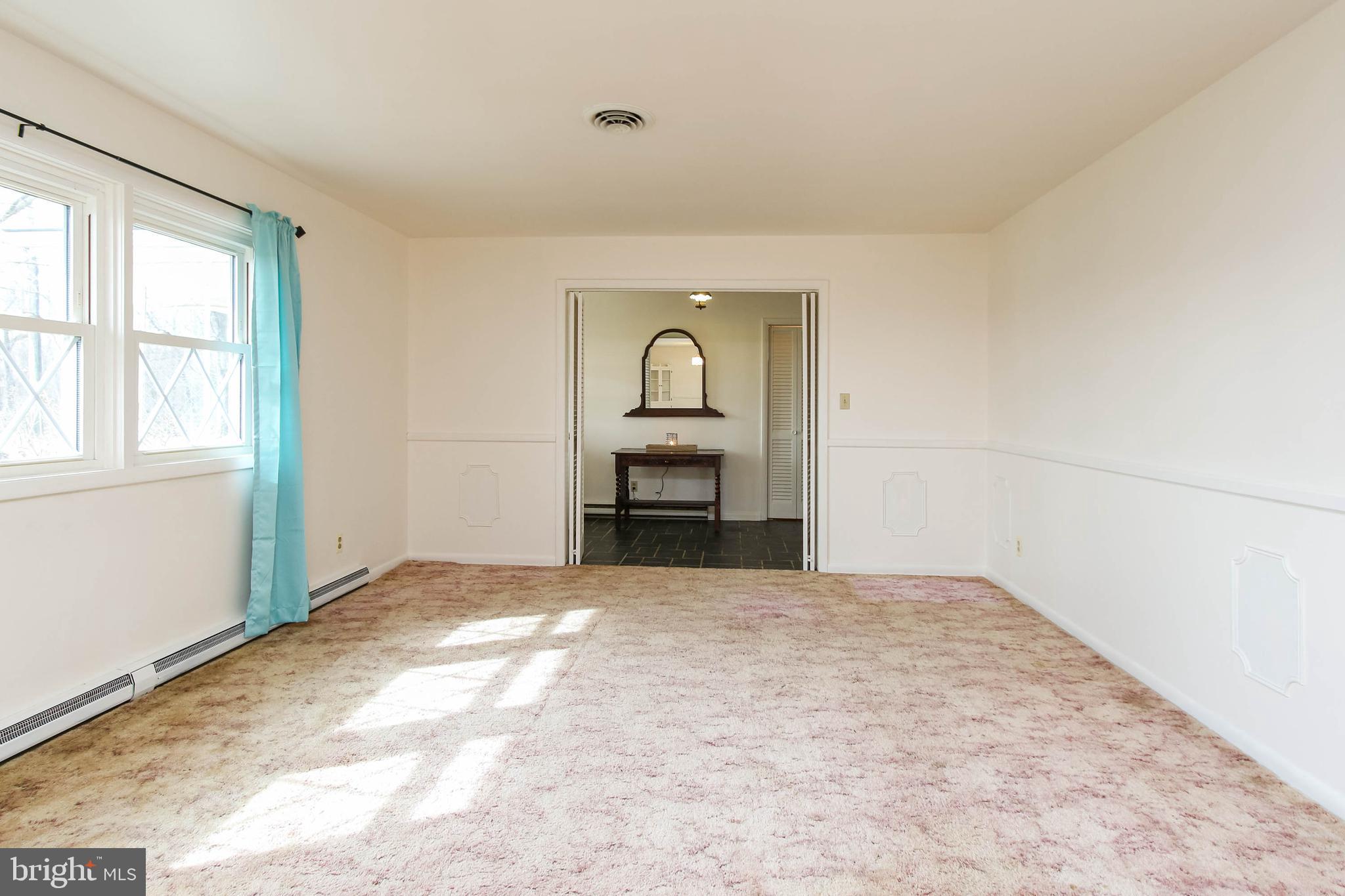 5004 Old Quarter Road Upperco, MD 21155 - Photo 9 of 61 a view of empty room with a fireplace and windows