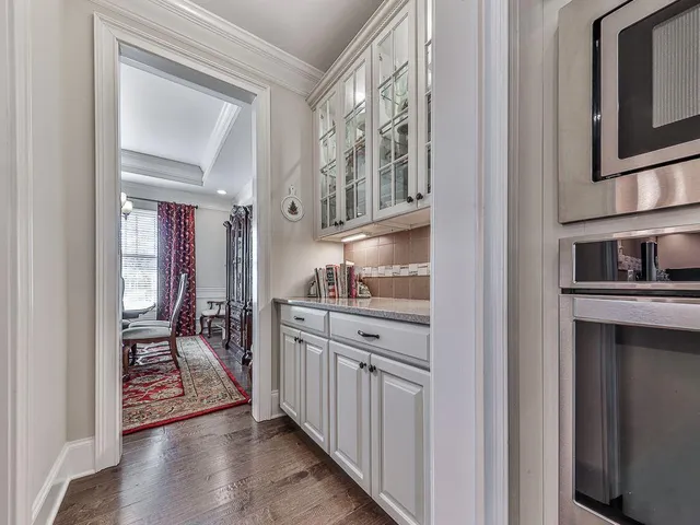 a view of walk in closet with clothes