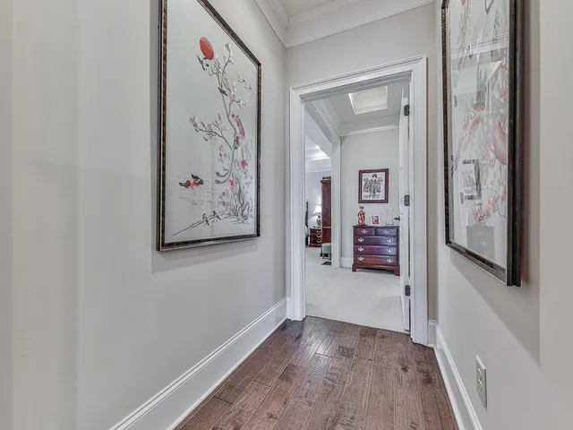 a bathroom with a toilet a sink a mirror and a shower