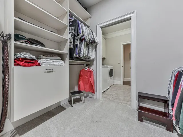 a living room with furniture a fireplace and wooden floor