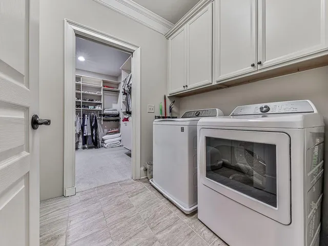 a bathroom with a granite countertop sink toilet mirror and bathtub
