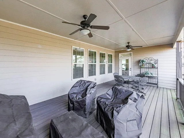 a room with lots of furniture and a rug