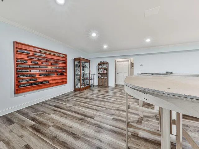 a view of a studio with wooden floor
