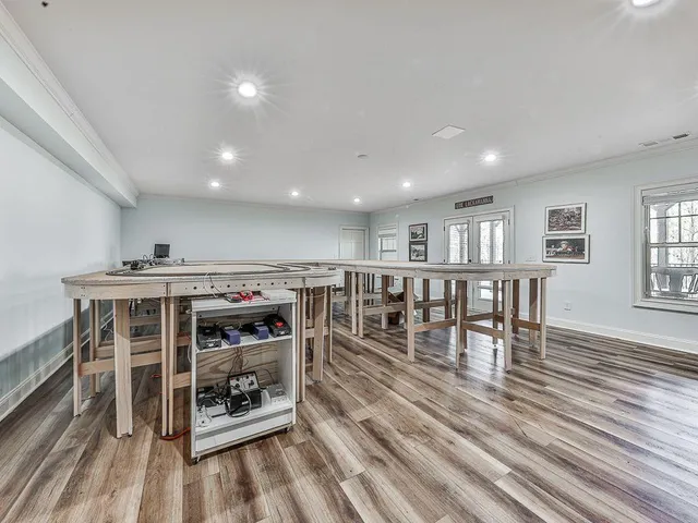 a view of balcony with wooden floor and outdoor seating