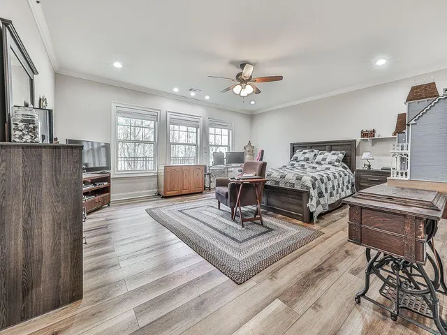 a living room with couch and a wooden floor