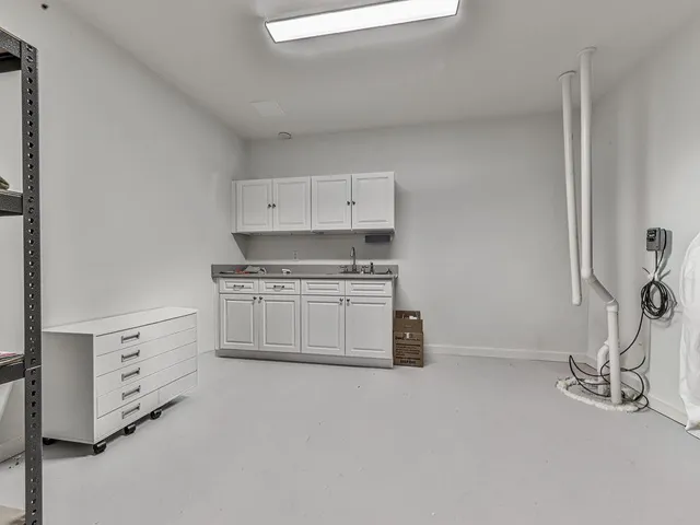 an aerial view of a house with outdoor space