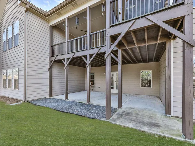 an aerial view of a house with yard swimming pool and outdoor seating