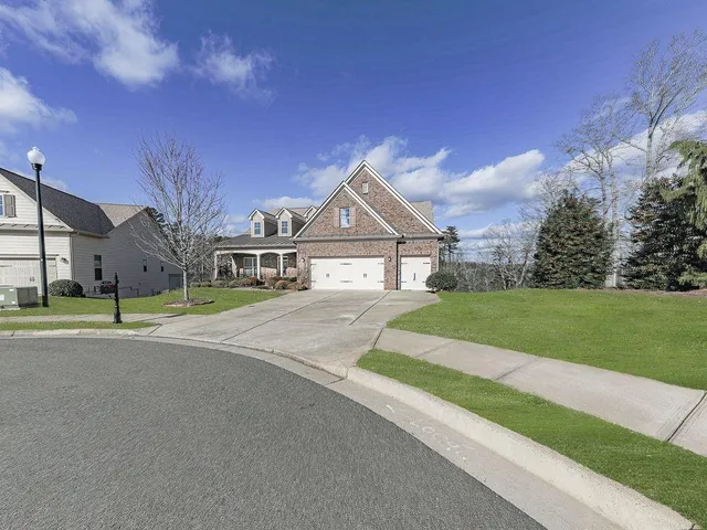 a view of a workspace with furniture and a bookshelf