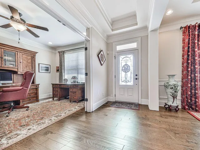 a living room with furniture fireplace and a flat screen tv