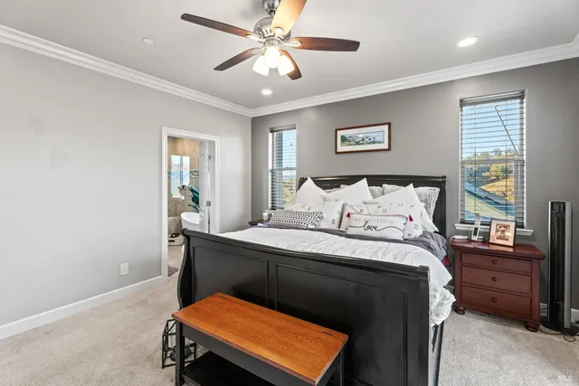 a bedroom with a bed and a tv