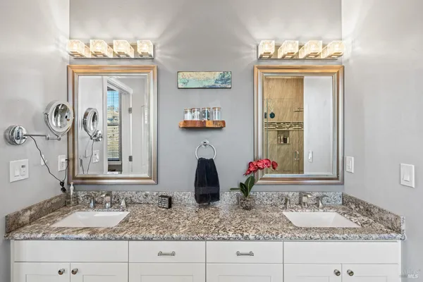 a bathroom with sink and mirror
