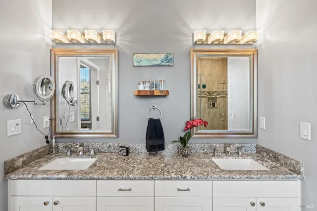 a bathroom with sink and mirror
