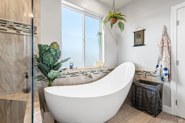 a white bath tub sitting in a bathroom