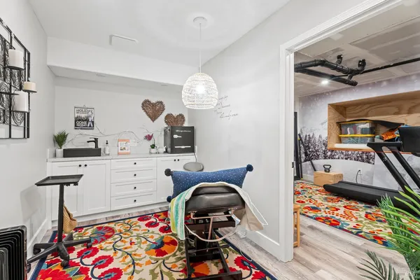 a bedroom with a bed and a dresser in it