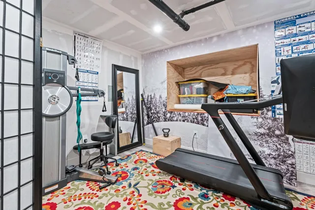 a living room with furniture and a floor to ceiling window