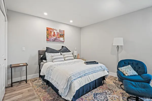 a bedroom with bed and furniture