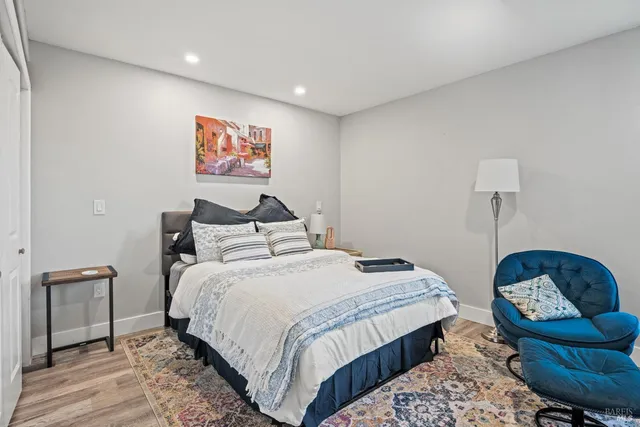 a bedroom with bed and furniture