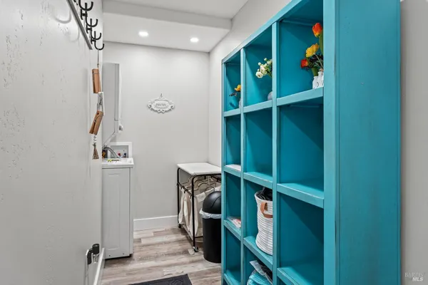 a view of an entryway with wooden floor