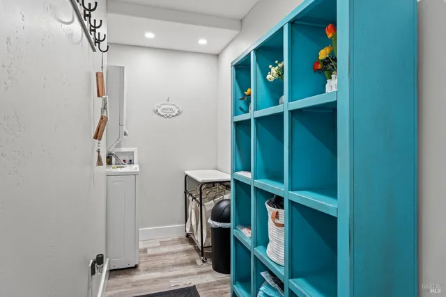 a view of an entryway with wooden floor