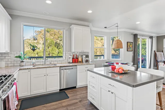 a kitchen with sink cabinets and window
