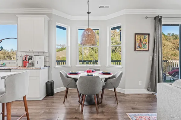 a view of a dining room with furniture window and outside view