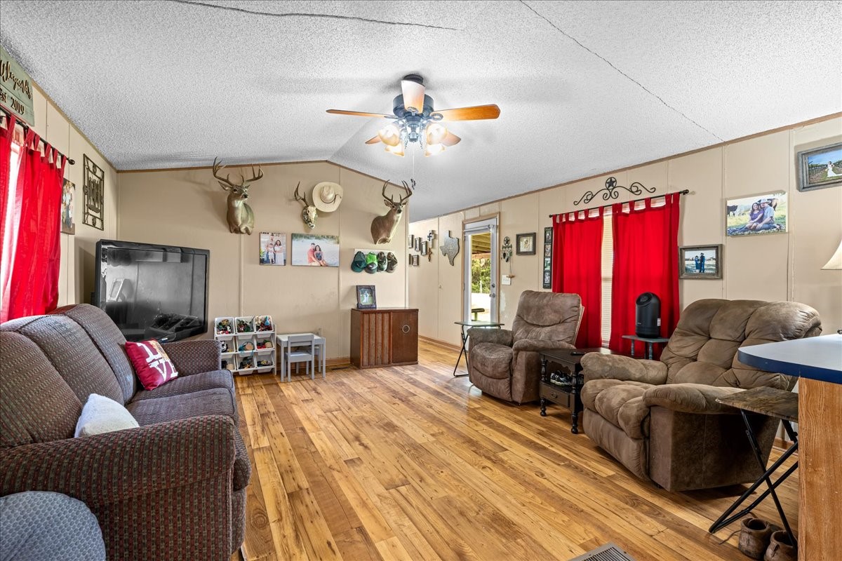 7300 Goehring Road Ledbetter, TX 78946 - Photo 11 of 15 a living room with furniture and a flat screen tv