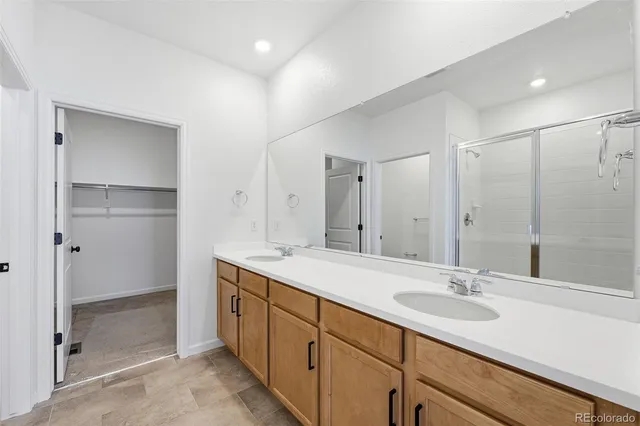 a bathroom with a glass shower door