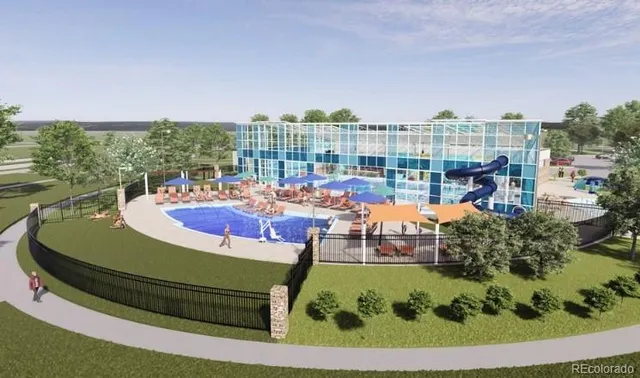 a city street lined with lots of buildings and cars