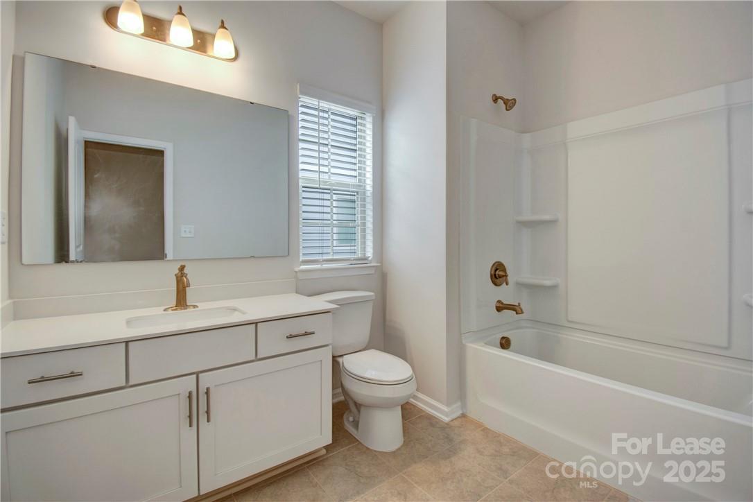 3130 Glenn Hope Way Matthews, NC 28104 - Photo 19 of 24 a bathroom with a sink a toilet and shower