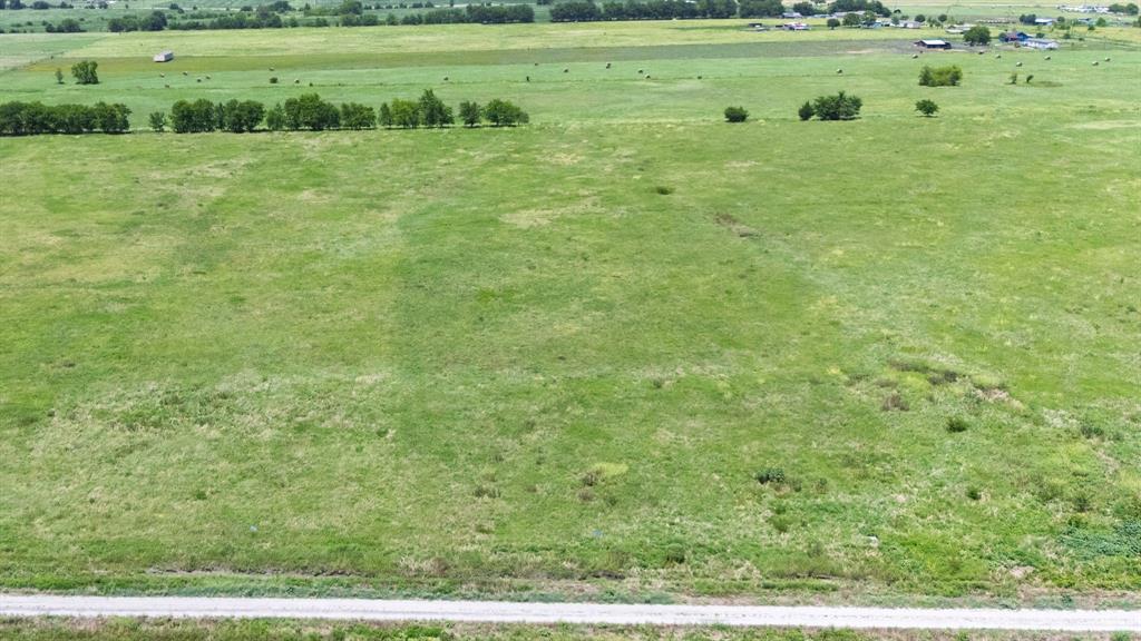 Lot 9 County Line Road Pecan Gap, TX 75469 - Photo 4 of 10 a view of a green field with clear sky