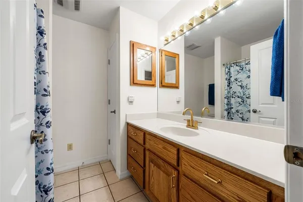 a bathroom with a sink a vanity and a mirror