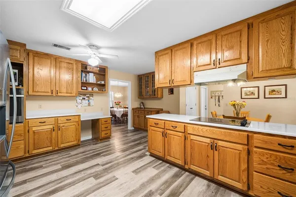 a open kitchen with stainless steel appliances granite countertop a sink dishwasher stove and refrigerator