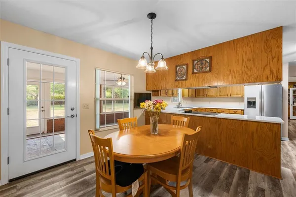 a dining room filled with furniture and window