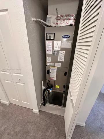 a view of a livingroom with furniture and front door