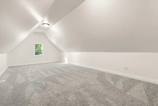 a view of an empty room and a window