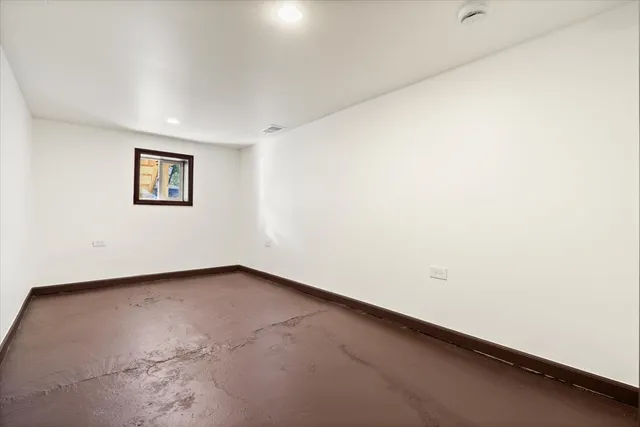 an empty room with a bench